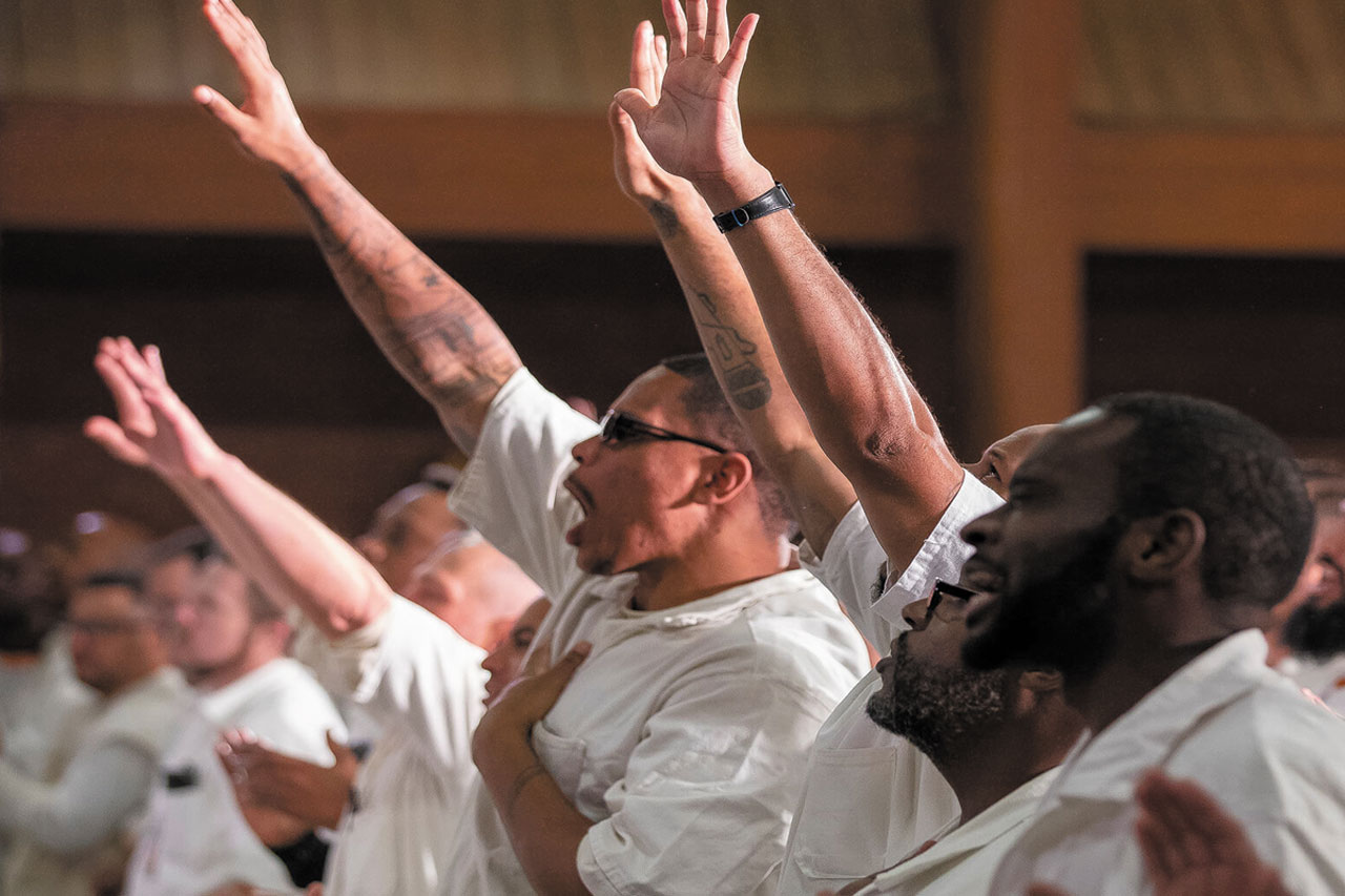Pastor preaching the Gospel to incarcerated individuals during a prison ministry session led by Thunders Tabernacle Ministry of Christ