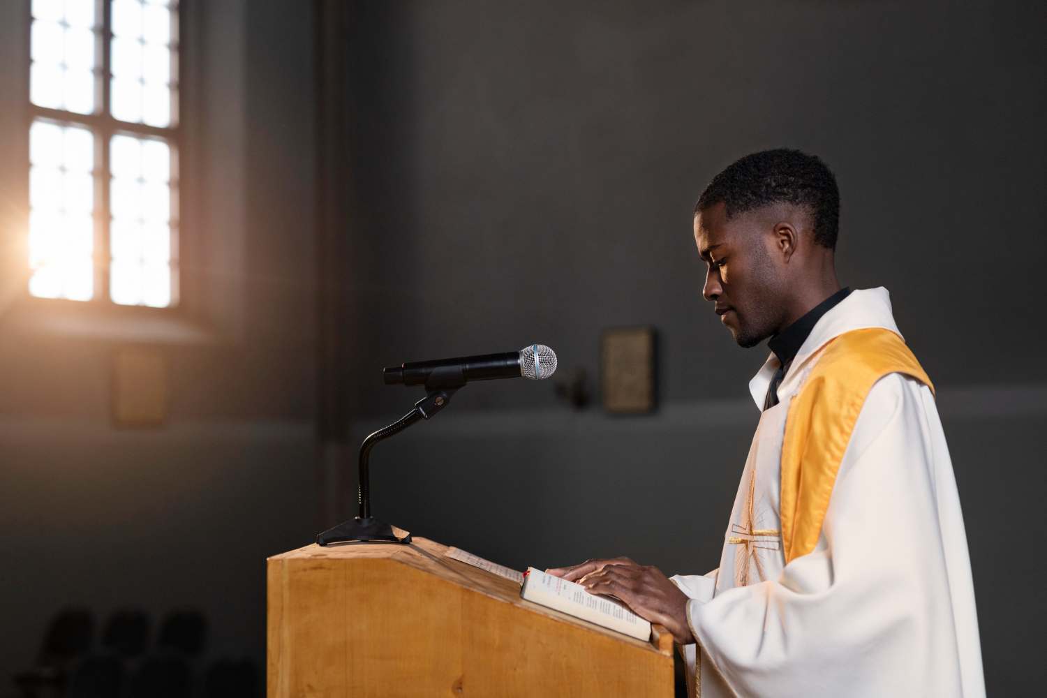 Young male priest preaching in the Thunders Tabernacle Ministry church