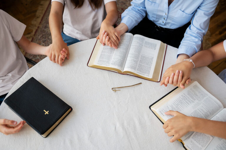 A group of individuals in an interactive spiritual development session, engaging in meaningful discussions about their faith journey.